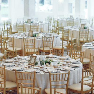 Beautiful round tables. Elegant wedding with gold furniture
